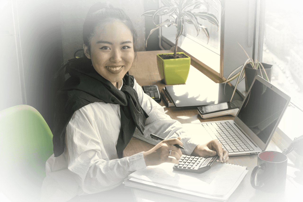 Businesswoman by a bright office window