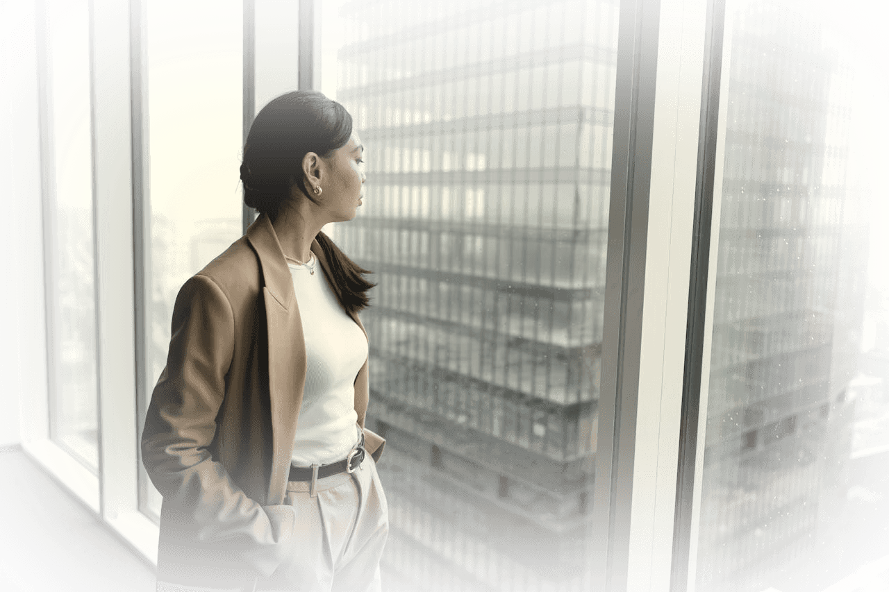 Businesswoman at a city-view window