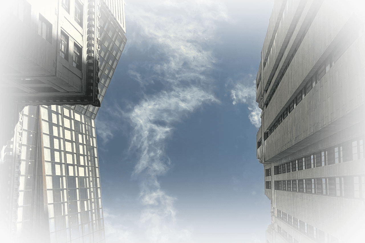 Glass skyscraper against a bright sky